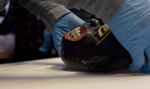 student conserving artefacts
