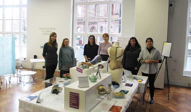 Photograph of four of our students providing some historical context.