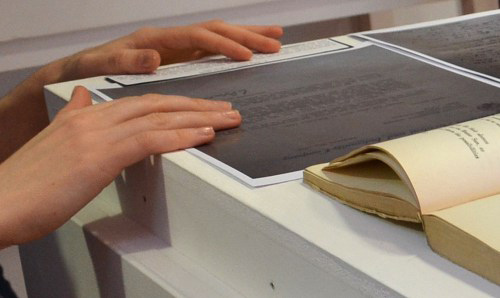 A student arranges reproductions of letters about 'Botteghe Oscure'. Photo courtesy of Chiara Zuanni.